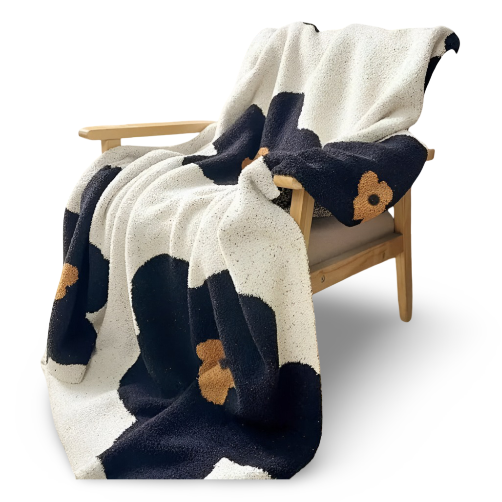 Blommönster Stickad Mysfilt – Bekväm och Stilig Inredningsfilt för Ditt Hem