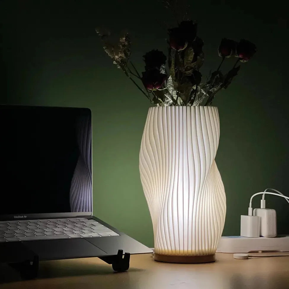Skulptural LED-bordslampa med elegant vågformad profil
