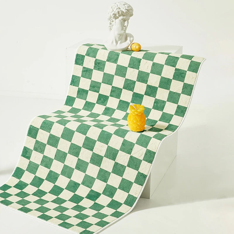 Sängkantsmatta med rutig design