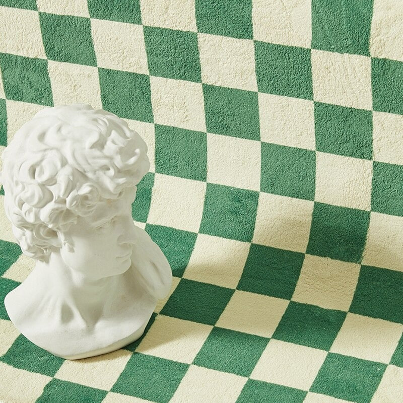 Sängkantsmatta med rutig design