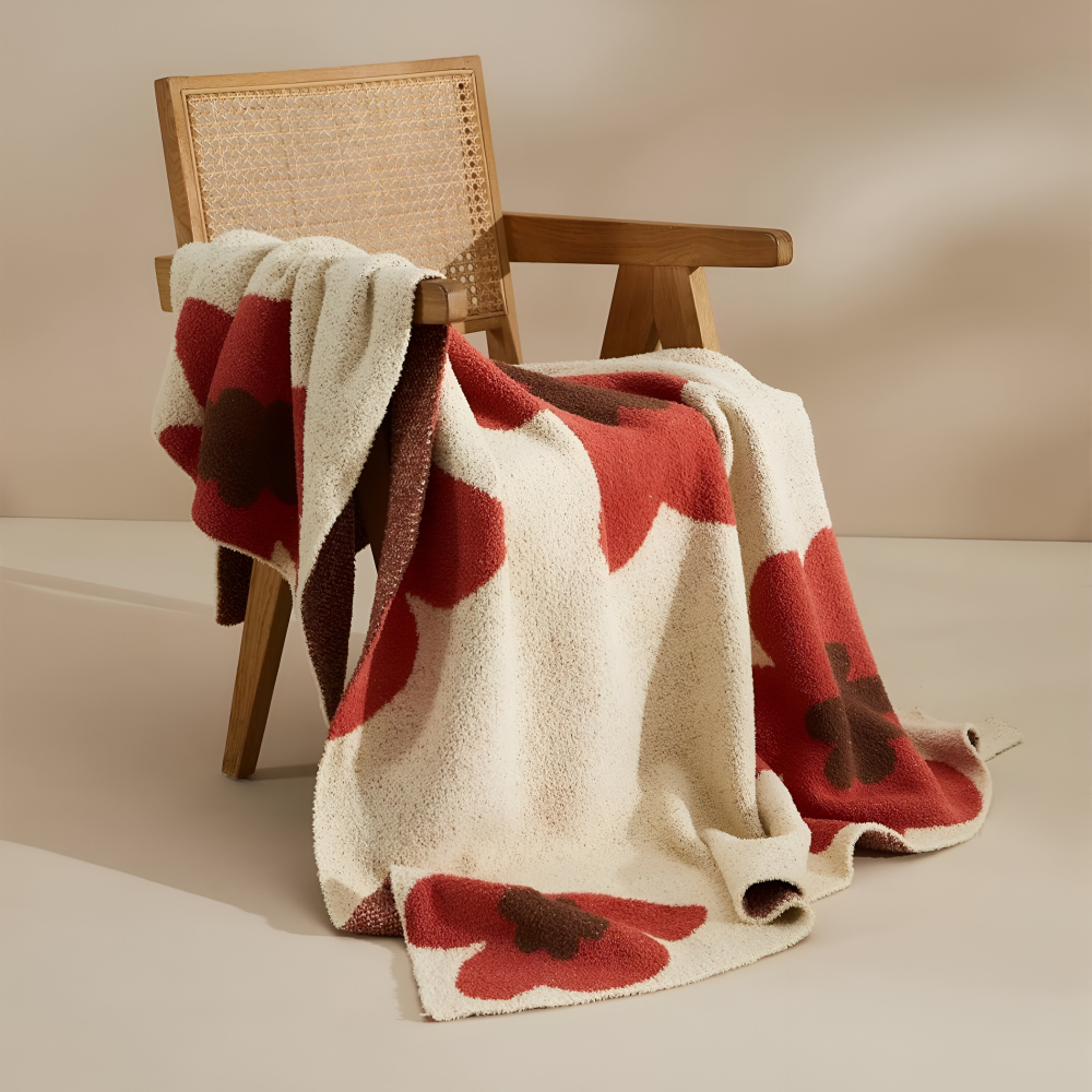 Blommönster Stickad Mysfilt – Bekväm och Stilig Inredningsfilt för Ditt Hem