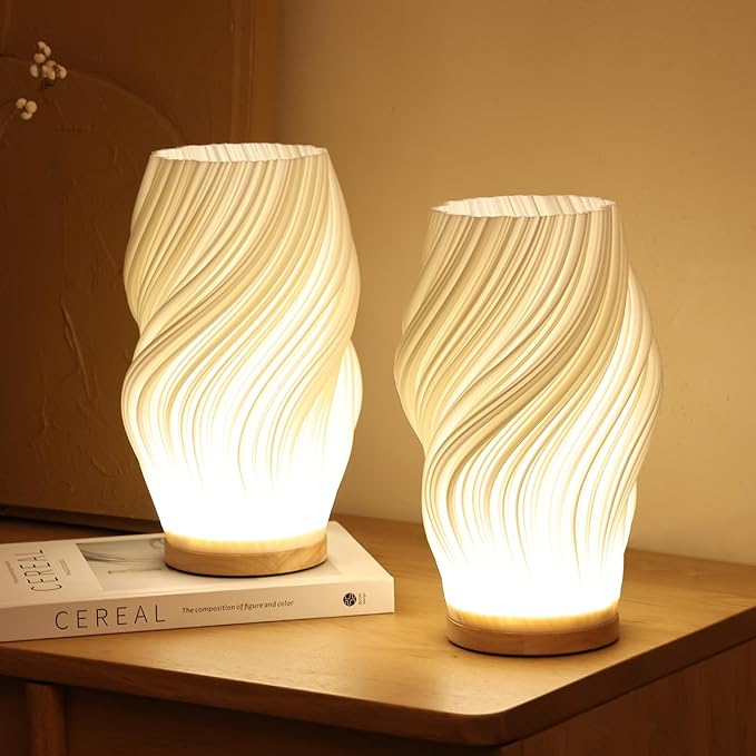 Stilren bordslampa med integrerad LED och unik vågdesign