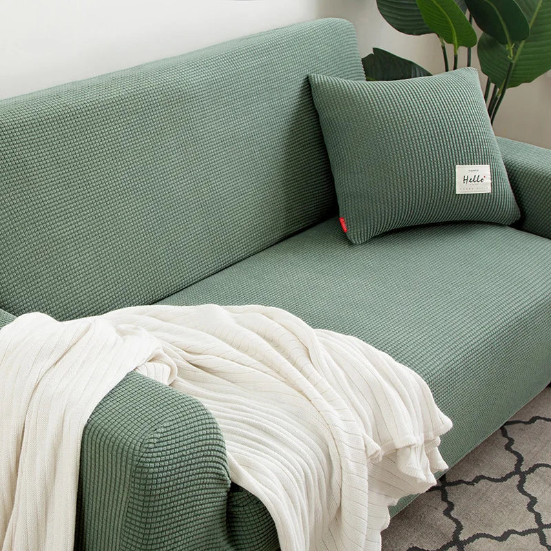 Sofföverdrag i stretchig jacquard på en 3-sitssoffa i vardagsrum