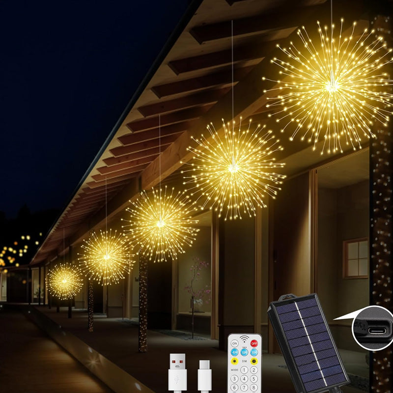 Flera solarlampor med fyrverkerieffekt som lyser i trädgårdsmiljö