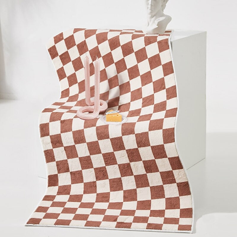 Sängkantsmatta med rutig design