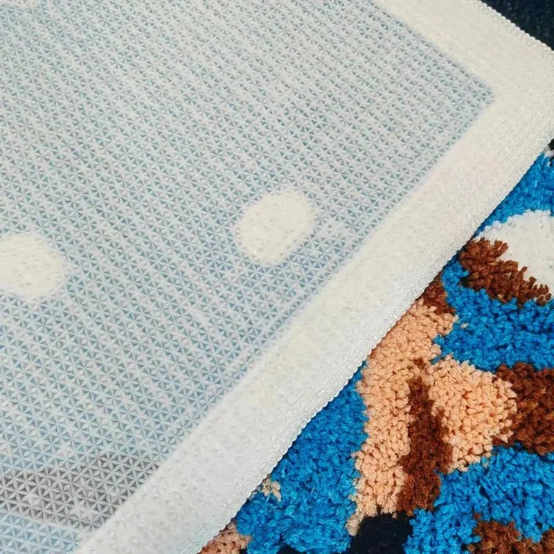 Detaljbild av mattans struktur och noggrant tuftade yta